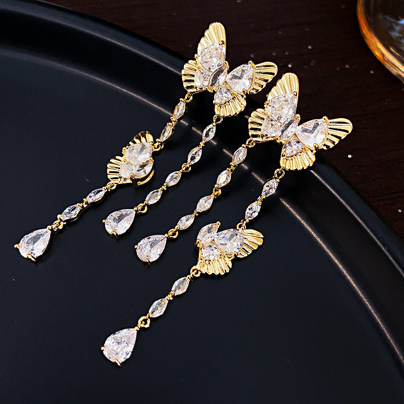 Women's Personality Butterfly Tassel Sier Needle Face Slimming Earrings